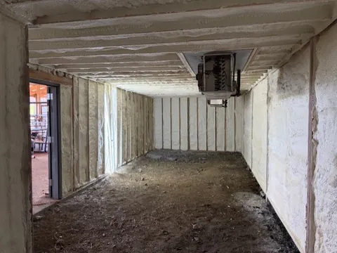 Encapsulated crawl space viewed toward the sealed access doorway