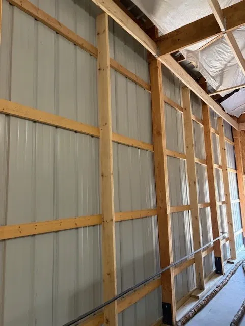 Framed garage interior before spray foam insulation is applied